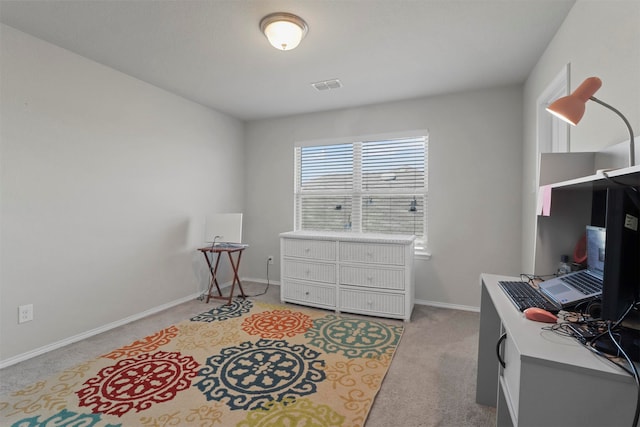 office area featuring light colored carpet