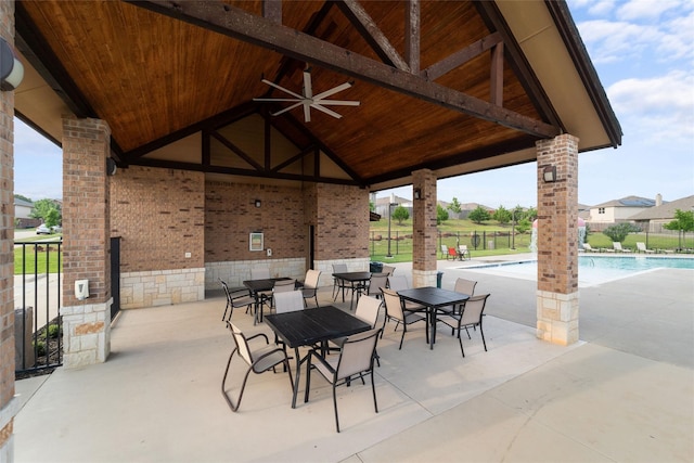 view of patio / terrace featuring ceiling fan and a community pool