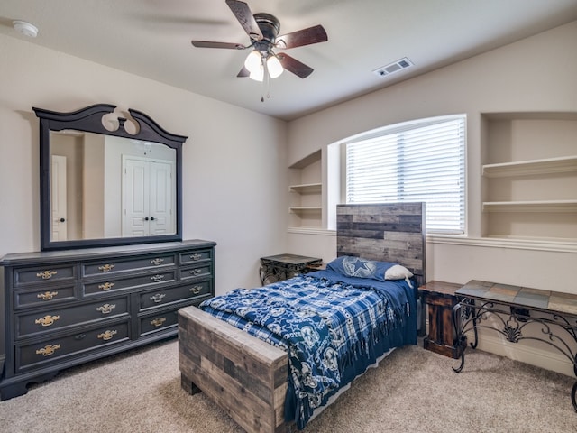 carpeted bedroom with ceiling fan