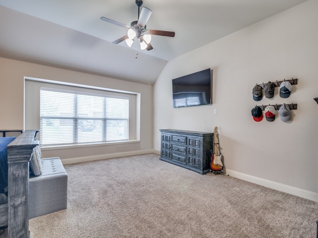 interior space featuring ceiling fan and lofted ceiling