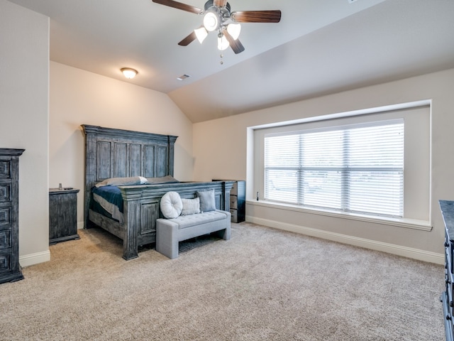 bedroom featuring ceiling fan, lofted ceiling, and light carpet