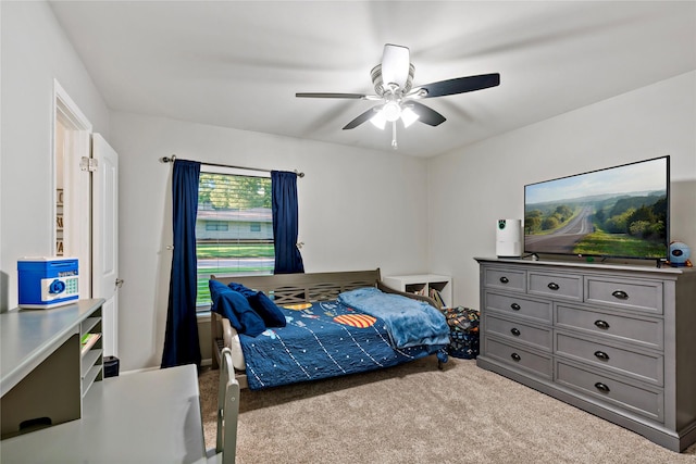 bedroom with light colored carpet and ceiling fan