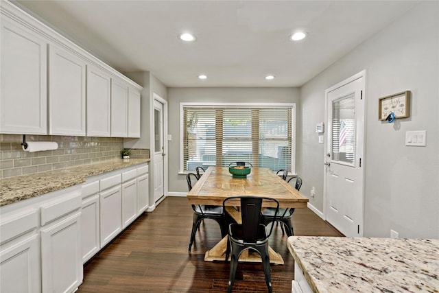 dining space featuring dark hardwood / wood-style floors