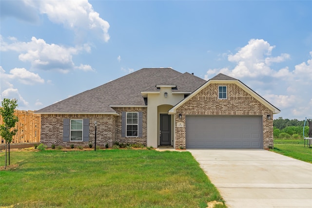 view of front facade with a front lawn and a garage