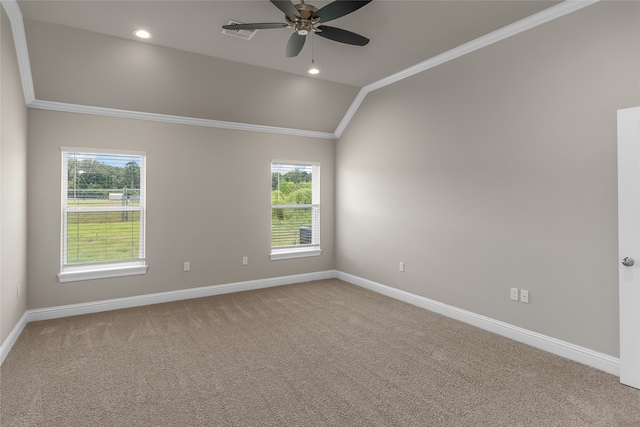 carpeted empty room featuring ceiling fan, crown molding, and lofted ceiling