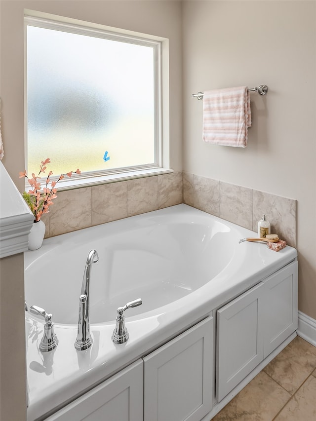 bathroom featuring a bathtub and tile patterned flooring