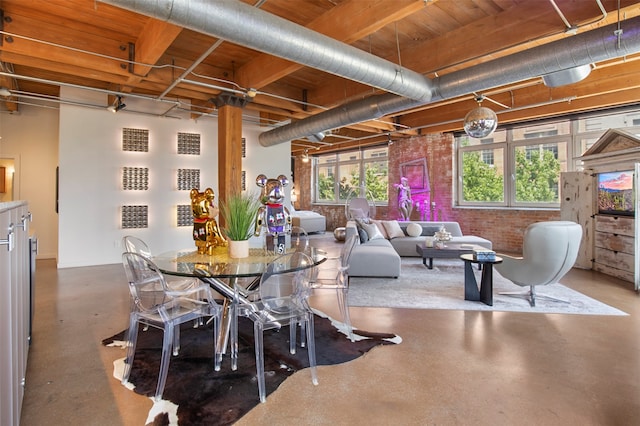 dining space featuring concrete flooring