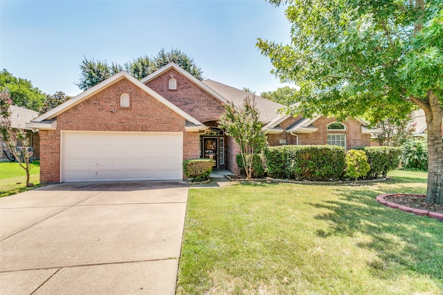 view of front of home with a front lawn and a garage