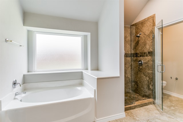 bathroom featuring tile patterned floors, lofted ceiling, plus walk in shower, and toilet