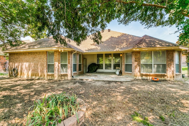 back of property with a patio area