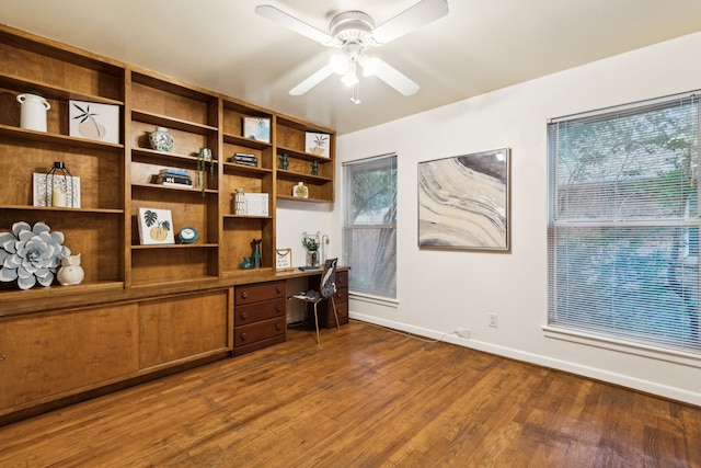 office area with ceiling fan and dark hardwood / wood-style floors