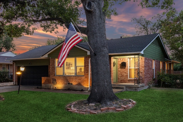 view of front facade featuring a yard and a garage