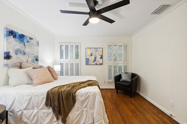 bedroom with multiple windows, crown molding, dark wood-type flooring, and ceiling fan