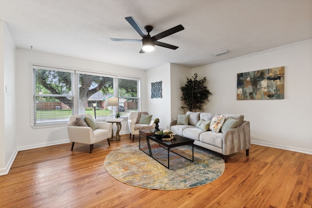 living room with ceiling fan and hardwood / wood-style flooring