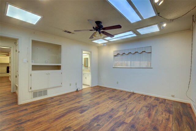 empty room with ceiling fan and wood-type flooring