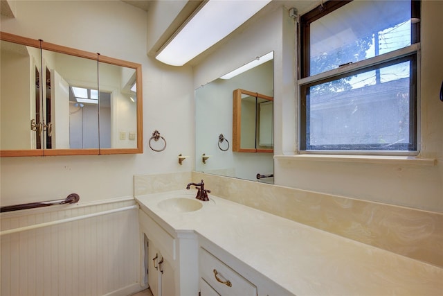 bathroom featuring wainscoting and vanity