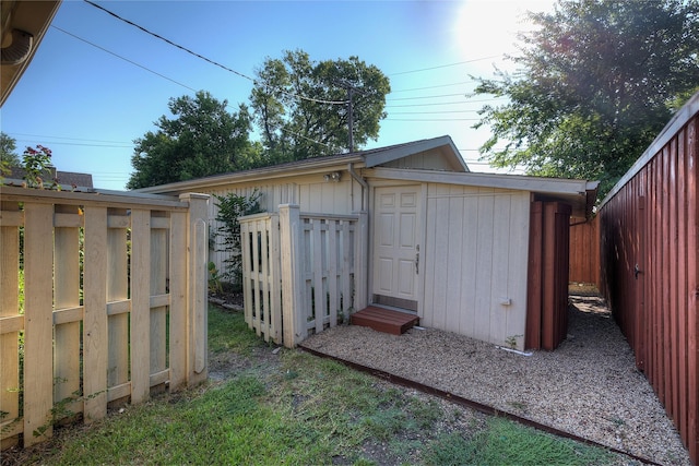 view of shed with fence