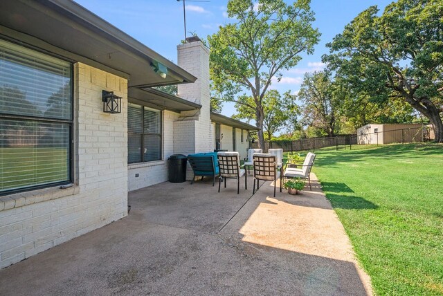 view of patio with a shed