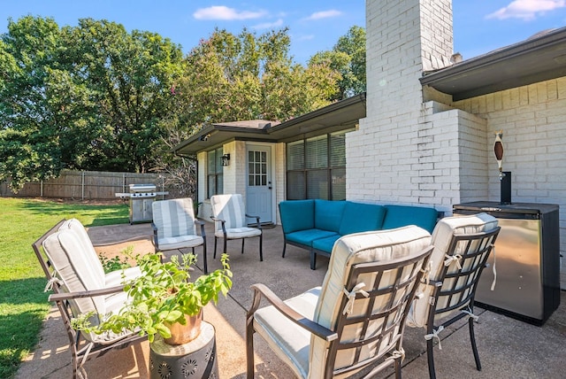 view of patio / terrace featuring an outdoor hangout area and a grill