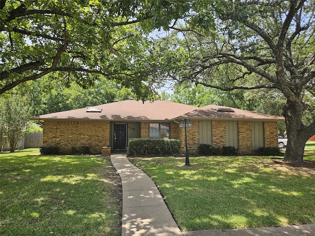 ranch-style house with a front yard