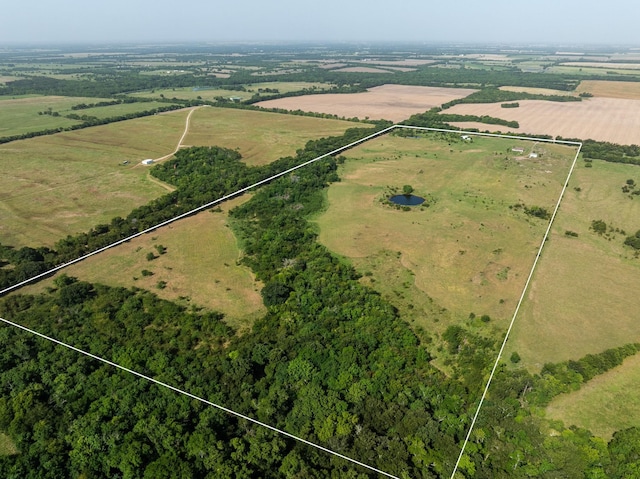 birds eye view of property featuring a rural view