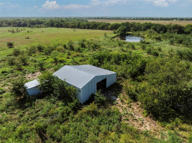 bird's eye view featuring a rural view and a water view