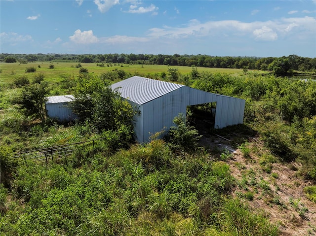 view of pole building featuring a rural view