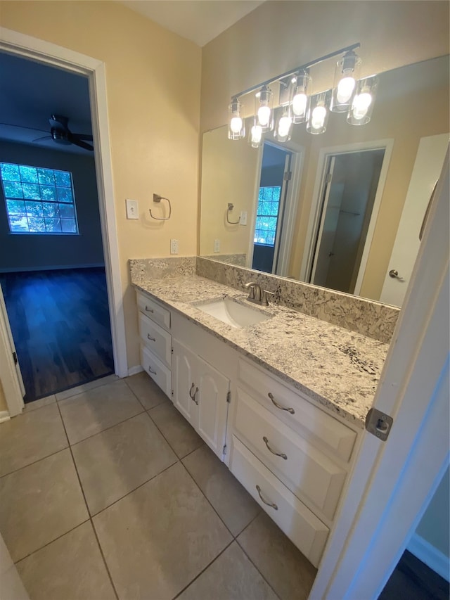 bathroom with plenty of natural light, vanity, and tile patterned flooring