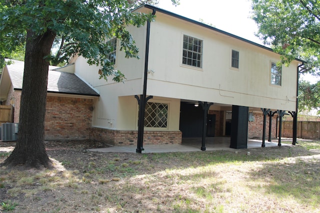 back of house with central air condition unit and a patio area