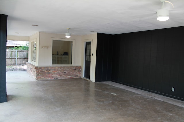 empty room with concrete flooring