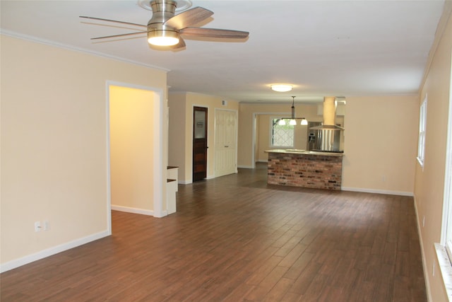 unfurnished living room featuring ceiling fan, crown molding, and dark hardwood / wood-style flooring