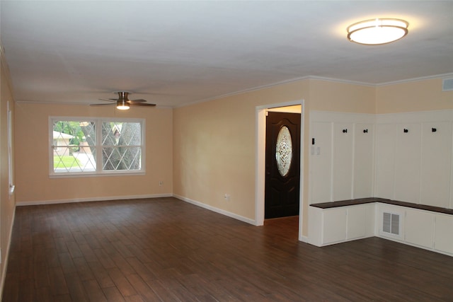 entryway featuring ornamental molding, dark hardwood / wood-style flooring, and ceiling fan