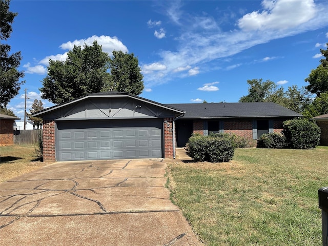 single story home with a garage and a front yard