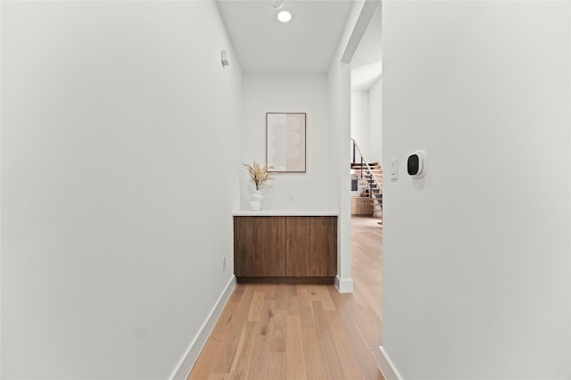 hallway with light wood-type flooring