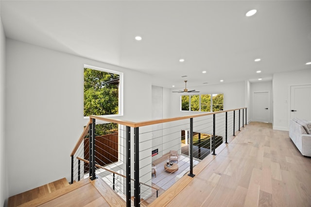 corridor with light hardwood / wood-style flooring