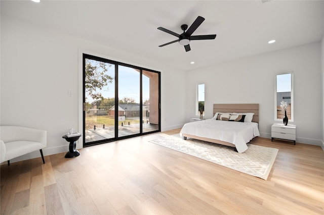 bedroom with ceiling fan, access to exterior, and hardwood / wood-style floors