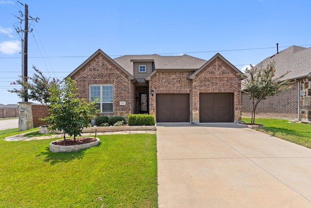 view of front of home featuring a garage and a front lawn