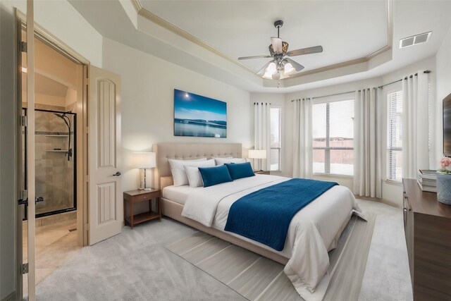 bedroom featuring ceiling fan, a raised ceiling, and crown molding