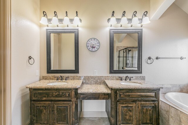 bathroom with independent shower and bath, tile patterned flooring, and vanity