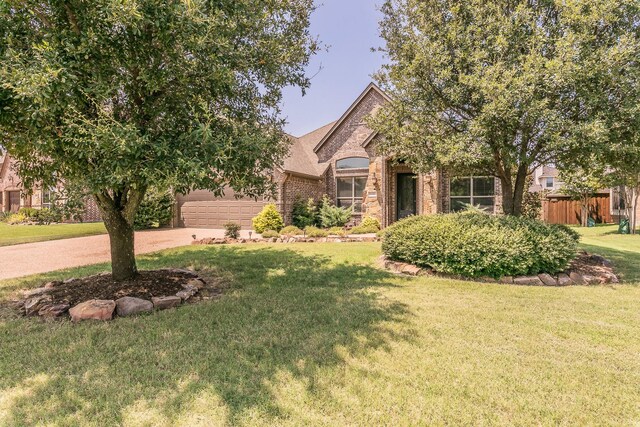 view of front facade with a front lawn and a garage