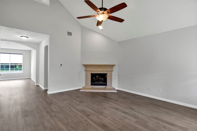 unfurnished living room with ceiling fan, high vaulted ceiling, and hardwood / wood-style flooring