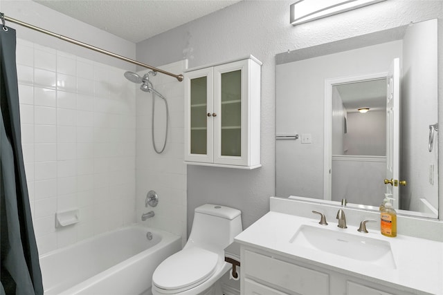 full bathroom with shower / bathtub combination with curtain, a textured ceiling, toilet, and vanity