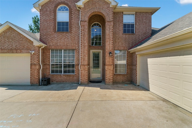 view of front of property with a garage