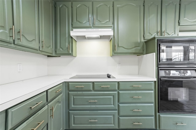 kitchen featuring green cabinets and black appliances