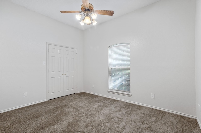 spare room with ceiling fan and carpet flooring