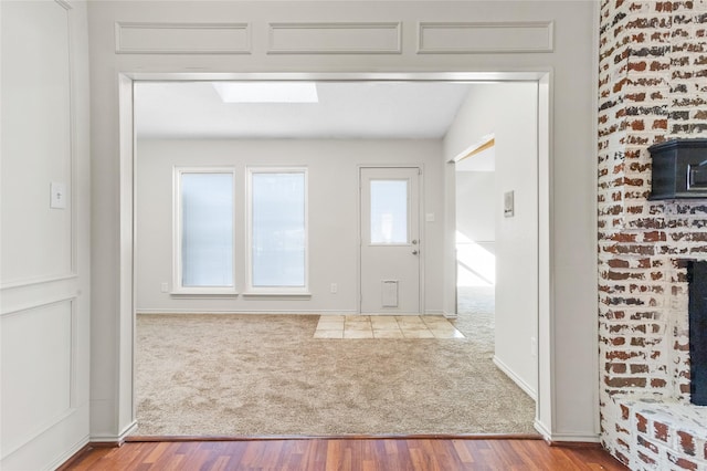 view of carpeted foyer