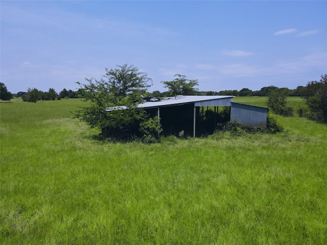 view of yard with a rural view