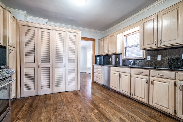 kitchen with appliances with stainless steel finishes, dark hardwood / wood-style flooring, backsplash, dark stone counters, and crown molding