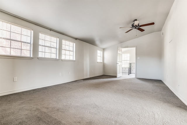 spare room with carpet flooring, ceiling fan, and lofted ceiling