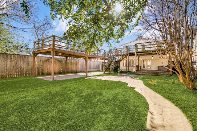 view of yard with a deck and a patio area